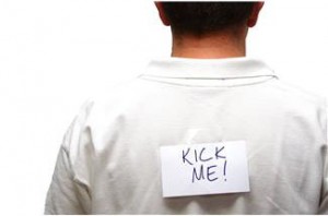 manMH900442445 false guilt - man with kick me written on his back