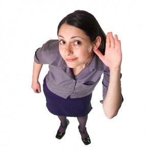 womanMP900399215 active listening - woman holding hand to her ear