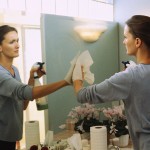 Woman Cleaning Mirror Spring Clean Your Life shown by woman cleaning mirror
